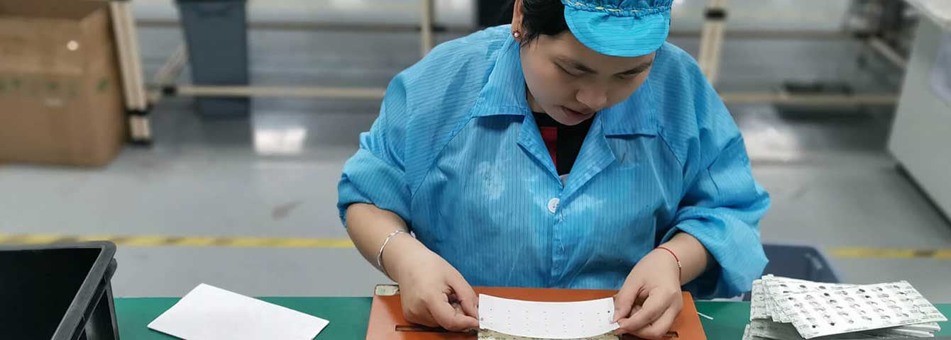 On the product mold, the employee is applying the flm 2